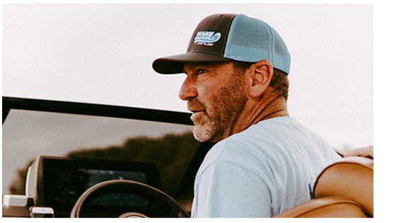 Man Driving a Car in a Cap